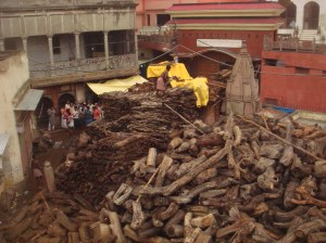 Family gather to buy wood for cremation